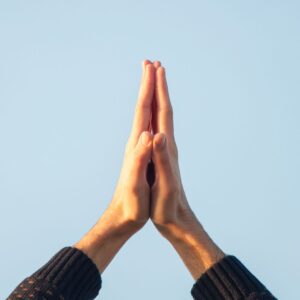 Hands clasped in prayer