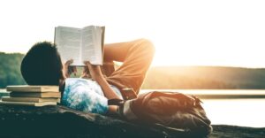 a person reading a book outside